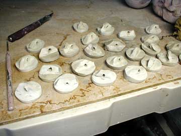 Ceramic buttons made from any suitable clay and fired